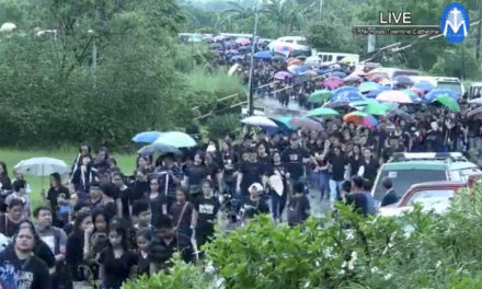 Sea of black as thousands flock to slain priest’s funeral