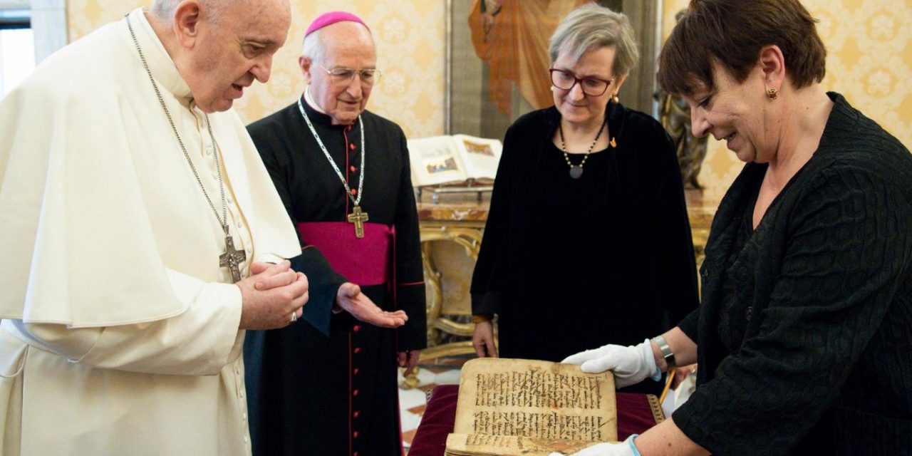 Pope Francis presented with historic prayer manuscript saved from Islamic State